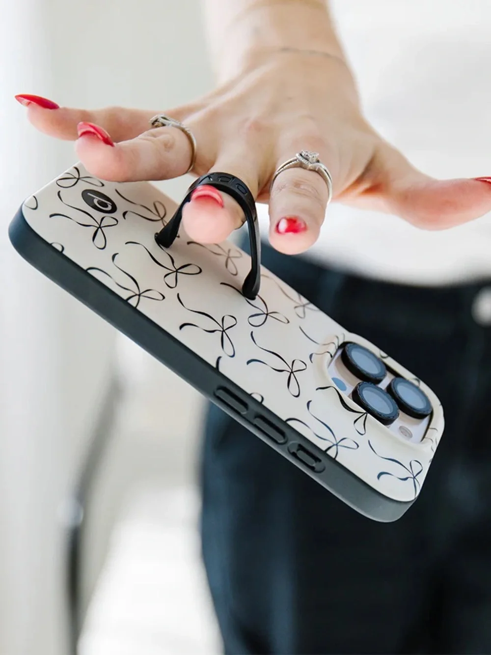 Loopy White Phone Case with Black Ribbon Bow Pattern and Black Grip 15 pro max
